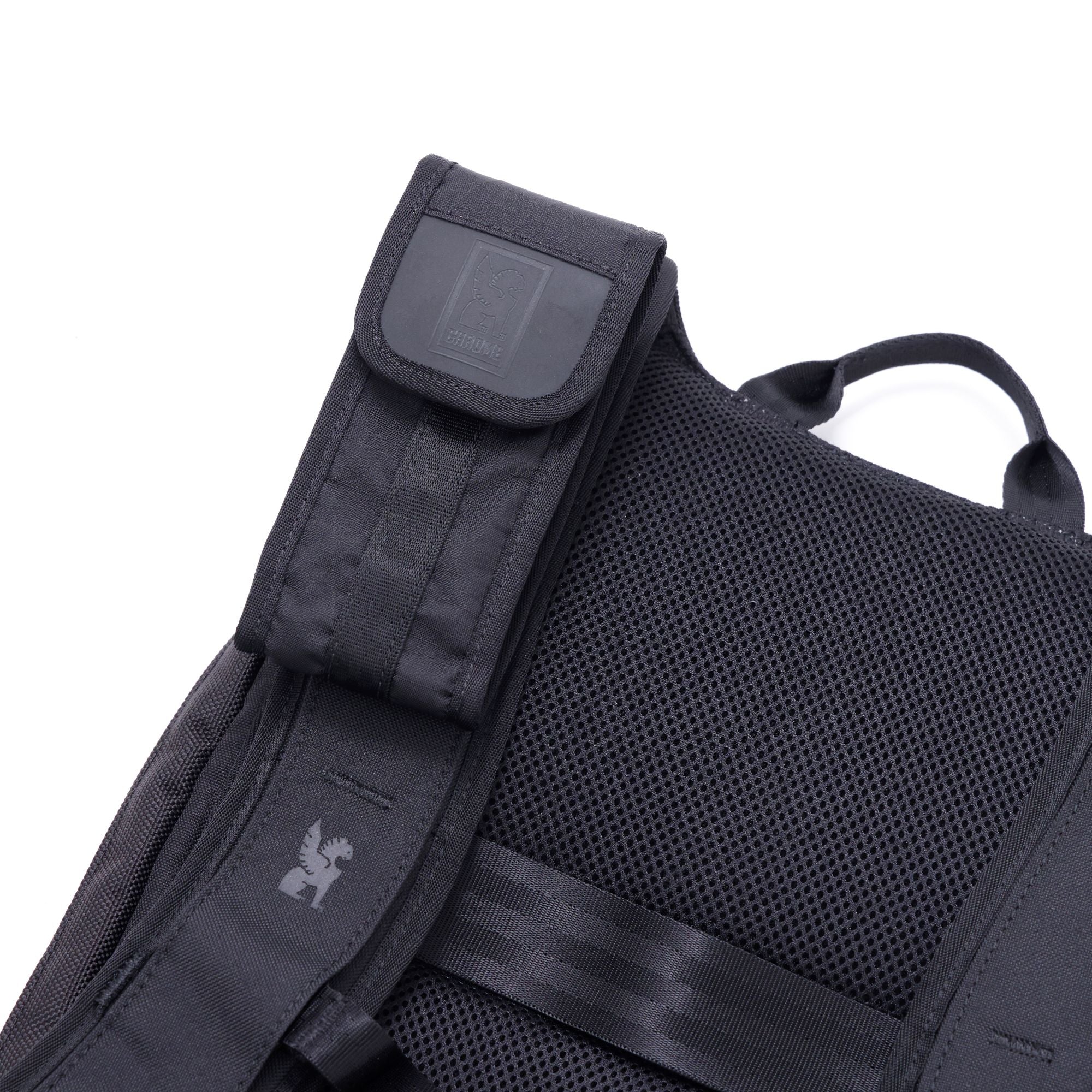 The Sunglass Pouch in black mounted on a backpack strap