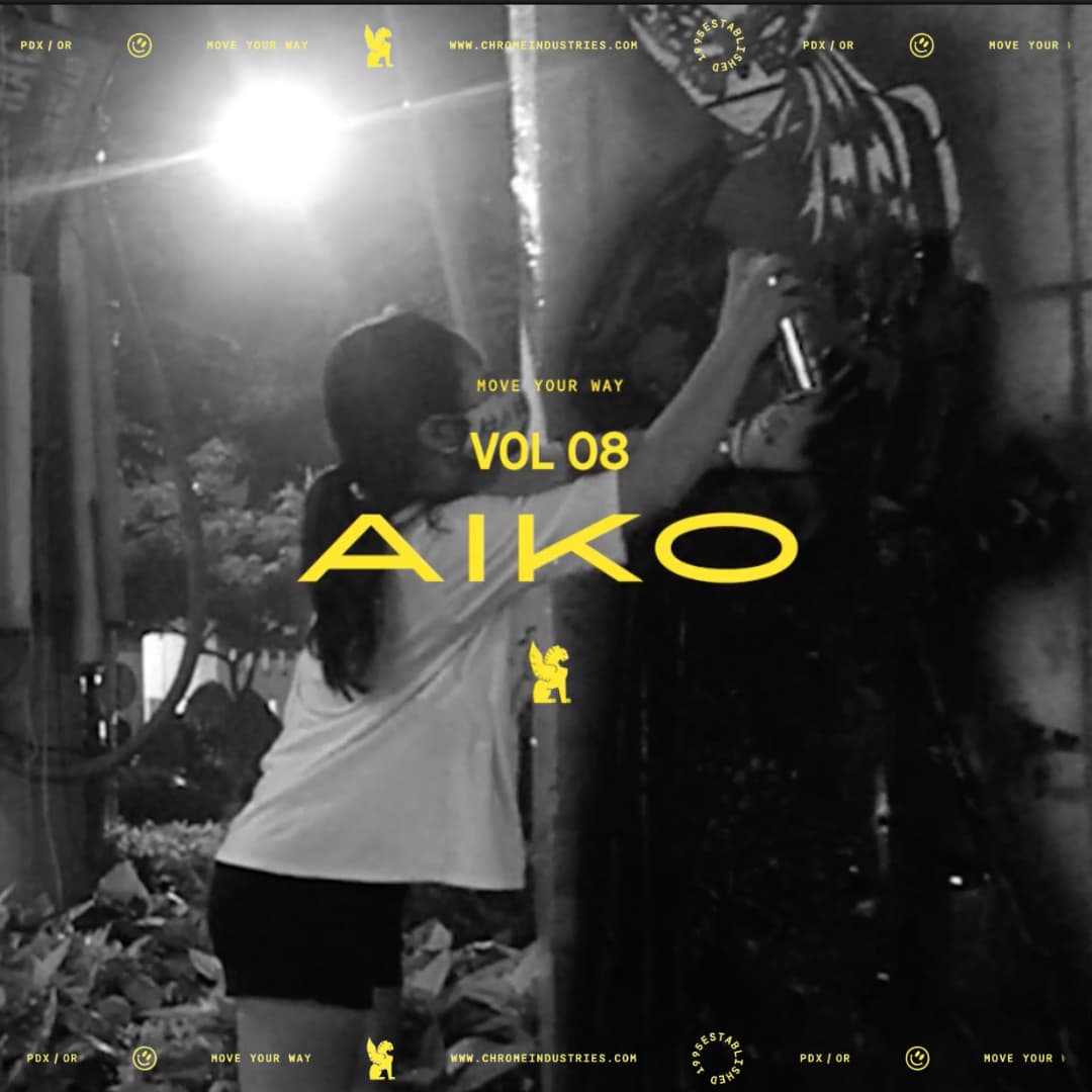 Aiko spray painting a wall