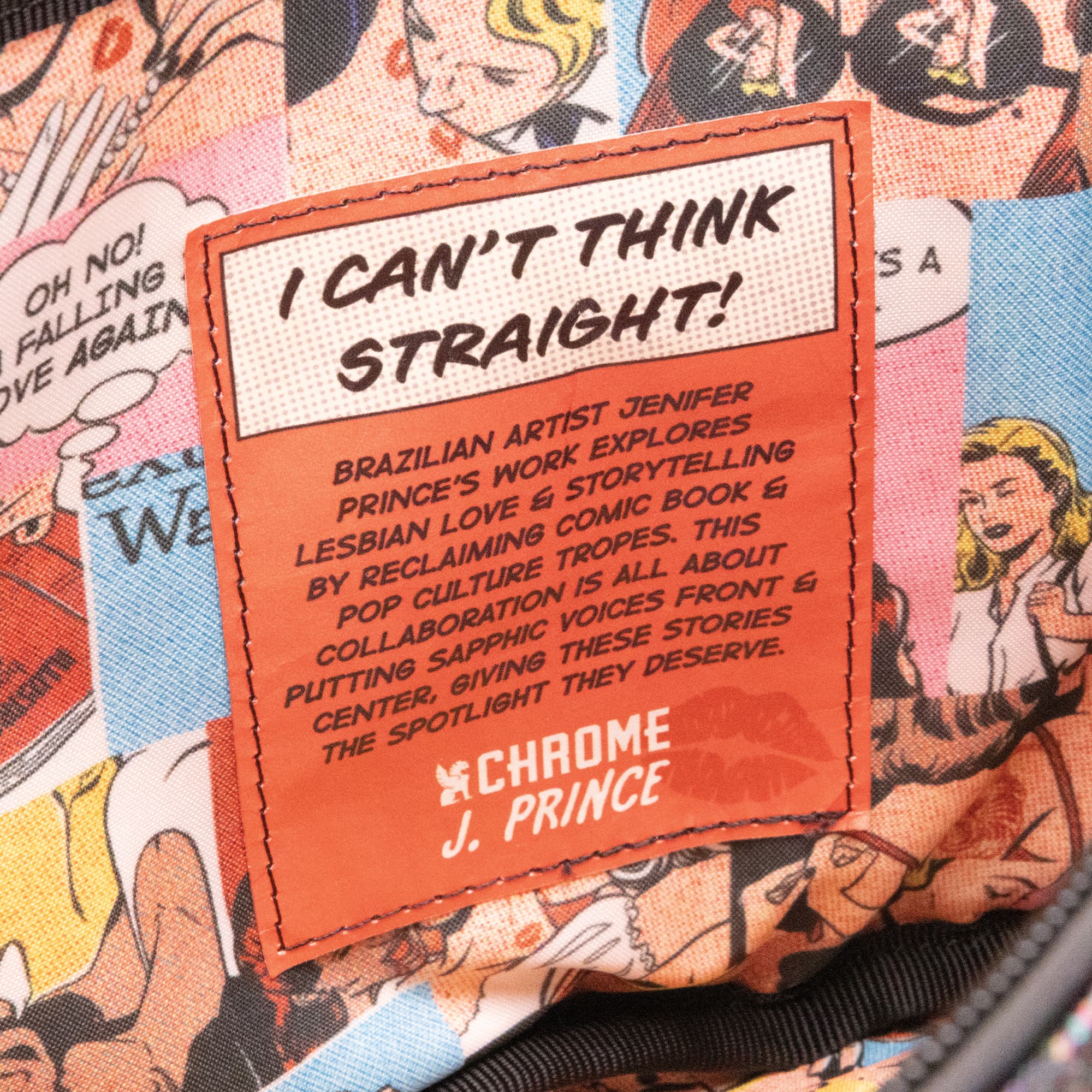 The inside patch in the J Prince Mini Kadet Pride bag #color_j prince