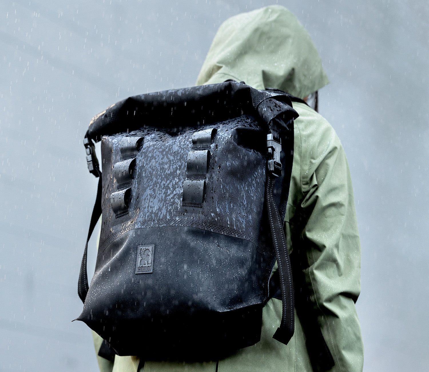 Waterproof Urban Ex 30L shown in the rain mobile banner size