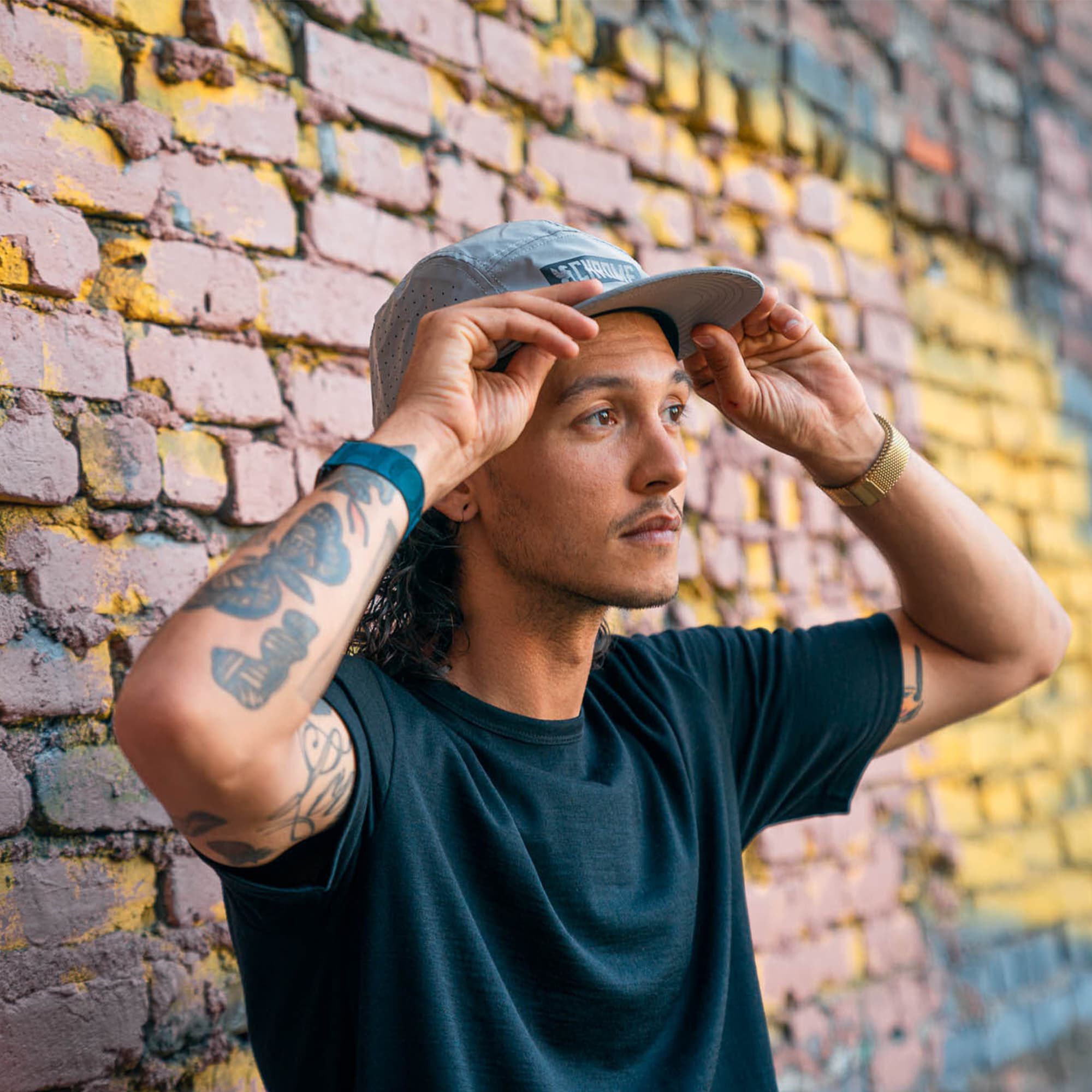 5-Panel Reflective Hat worn by a man 